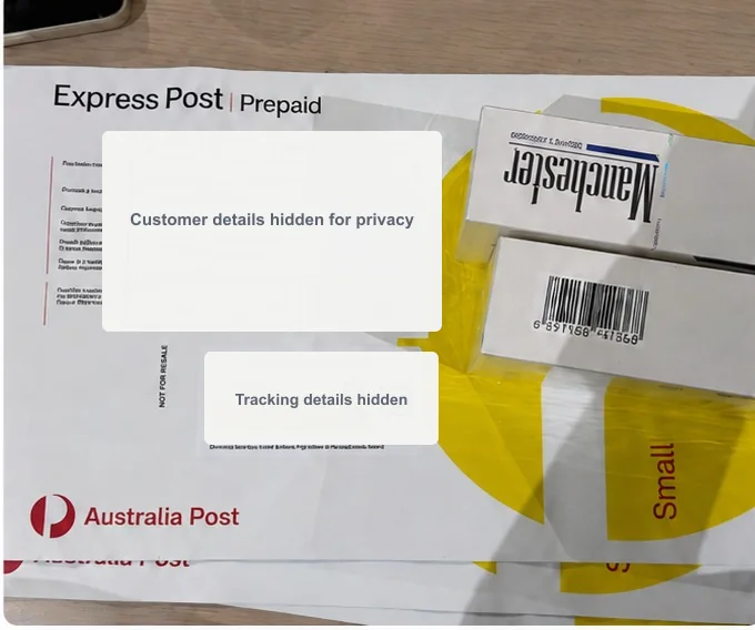 Packed Australia Post order with customer and tracking details hidden for privacy